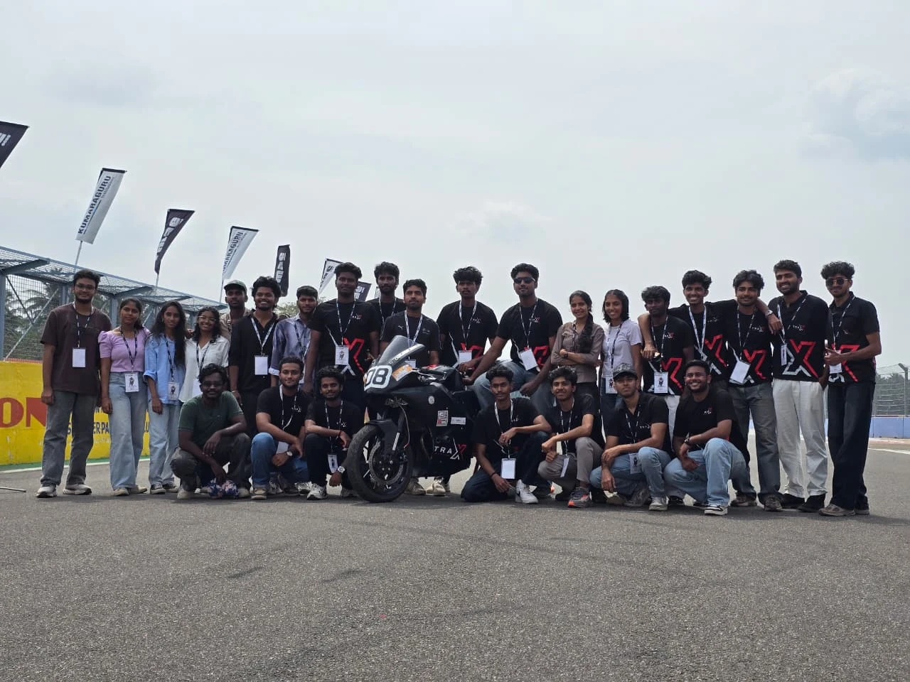 Team TRAX 04 with motorcycle at competition track