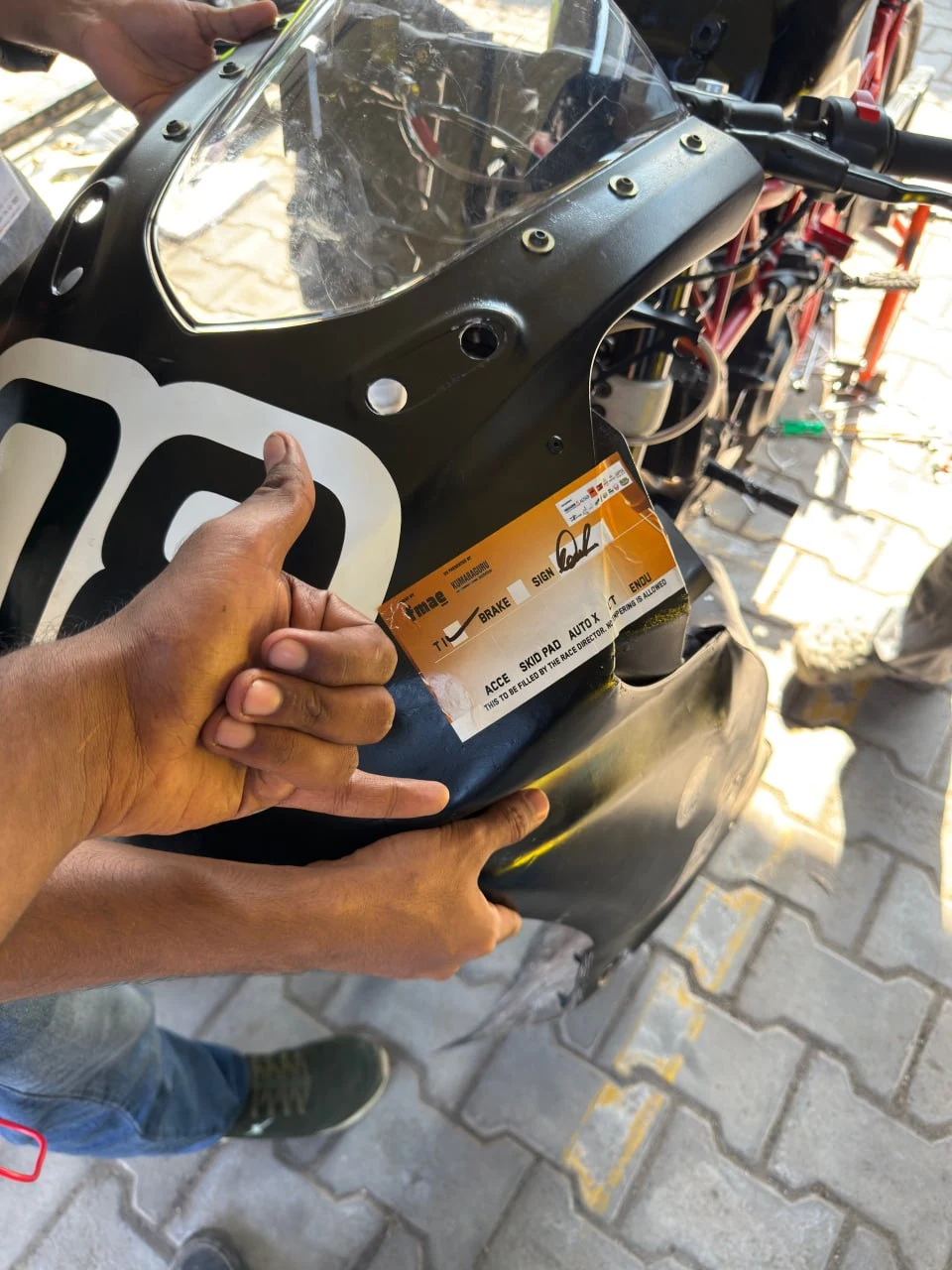 Technical inspection pass sticker on motorcycle frame